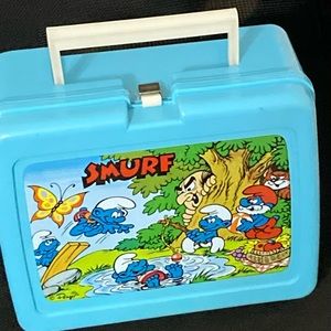 Smurf vintage plastic lunch boxes.